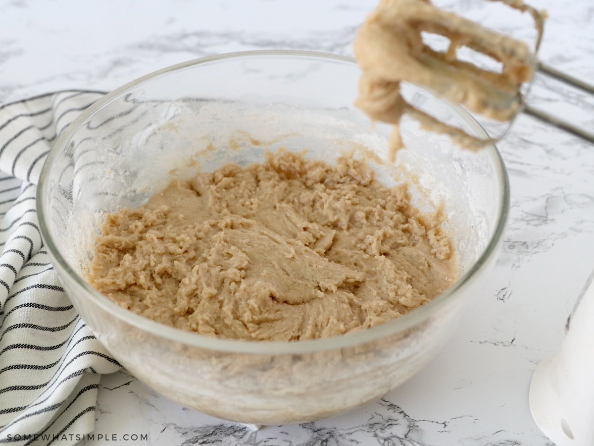 combining wet and dry ingredients in a glass bowl