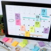 framed seasonal bucket list with colorful post it notes