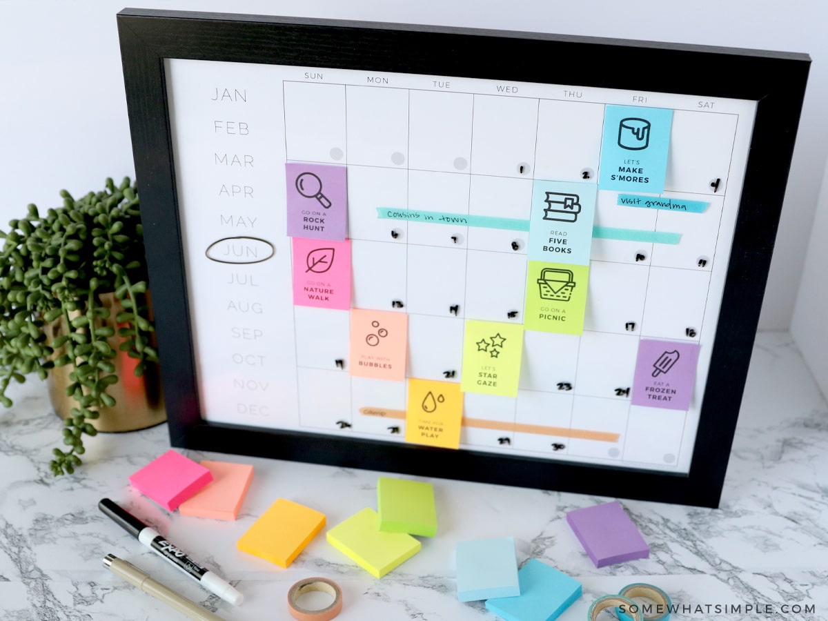 framed seasonal bucket list with colorful post it notes