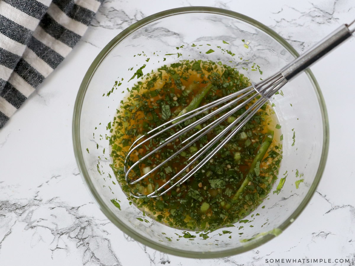 mixing ingredients for chili lime sauce in a mixing bowl