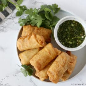 chili lime sauce on a plate with egg rolls