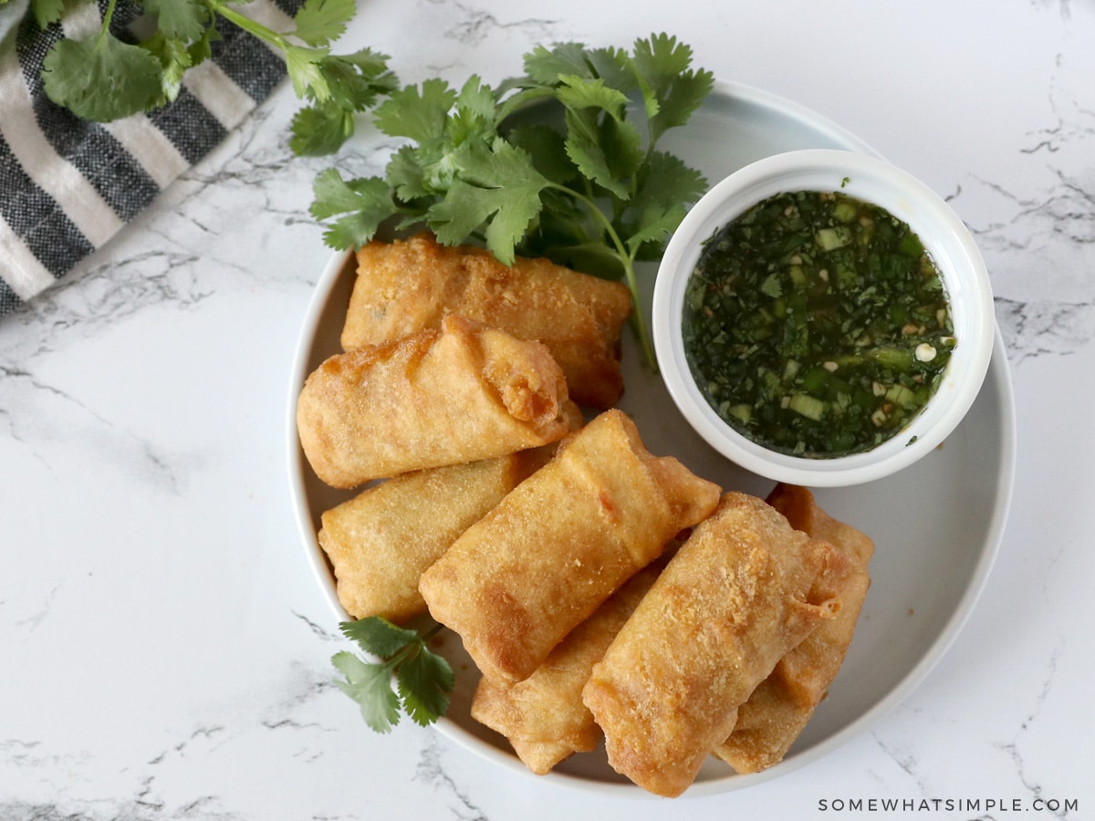 chili lime sauce on a plate with egg rolls