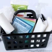 black basket with kid-friendly cleaning supplies