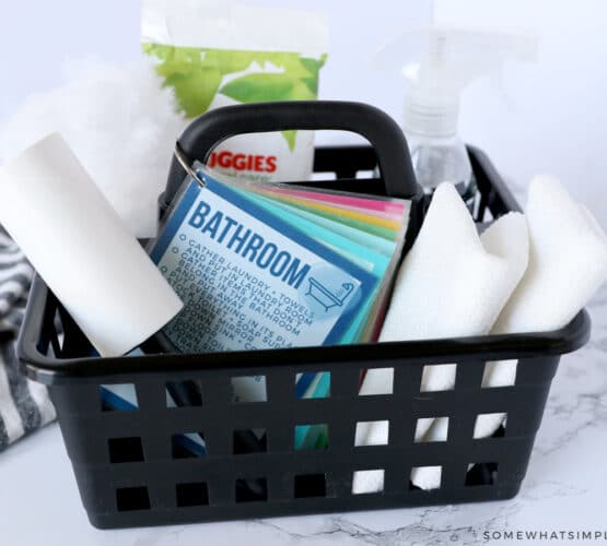 black basket with kid-friendly cleaning supplies