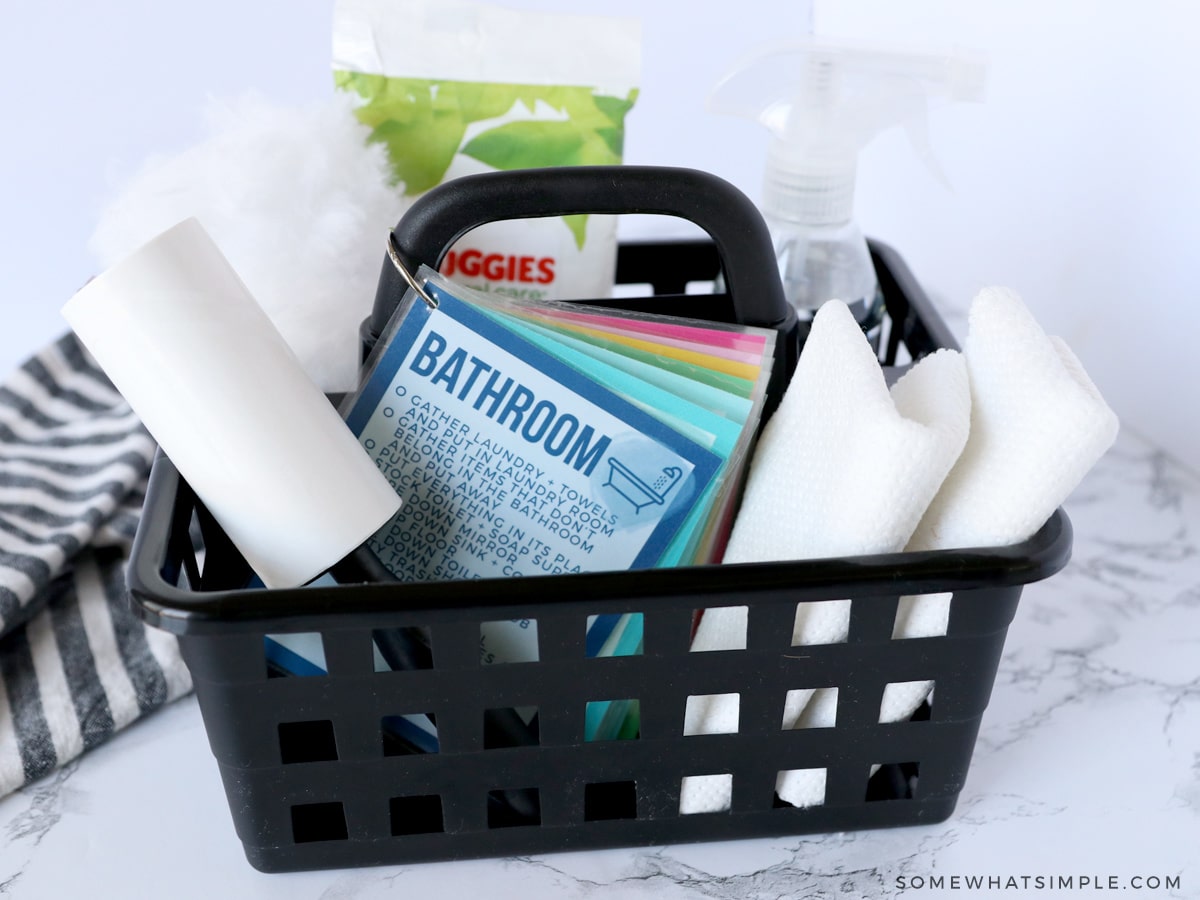 black basket with kid-friendly cleaning supplies