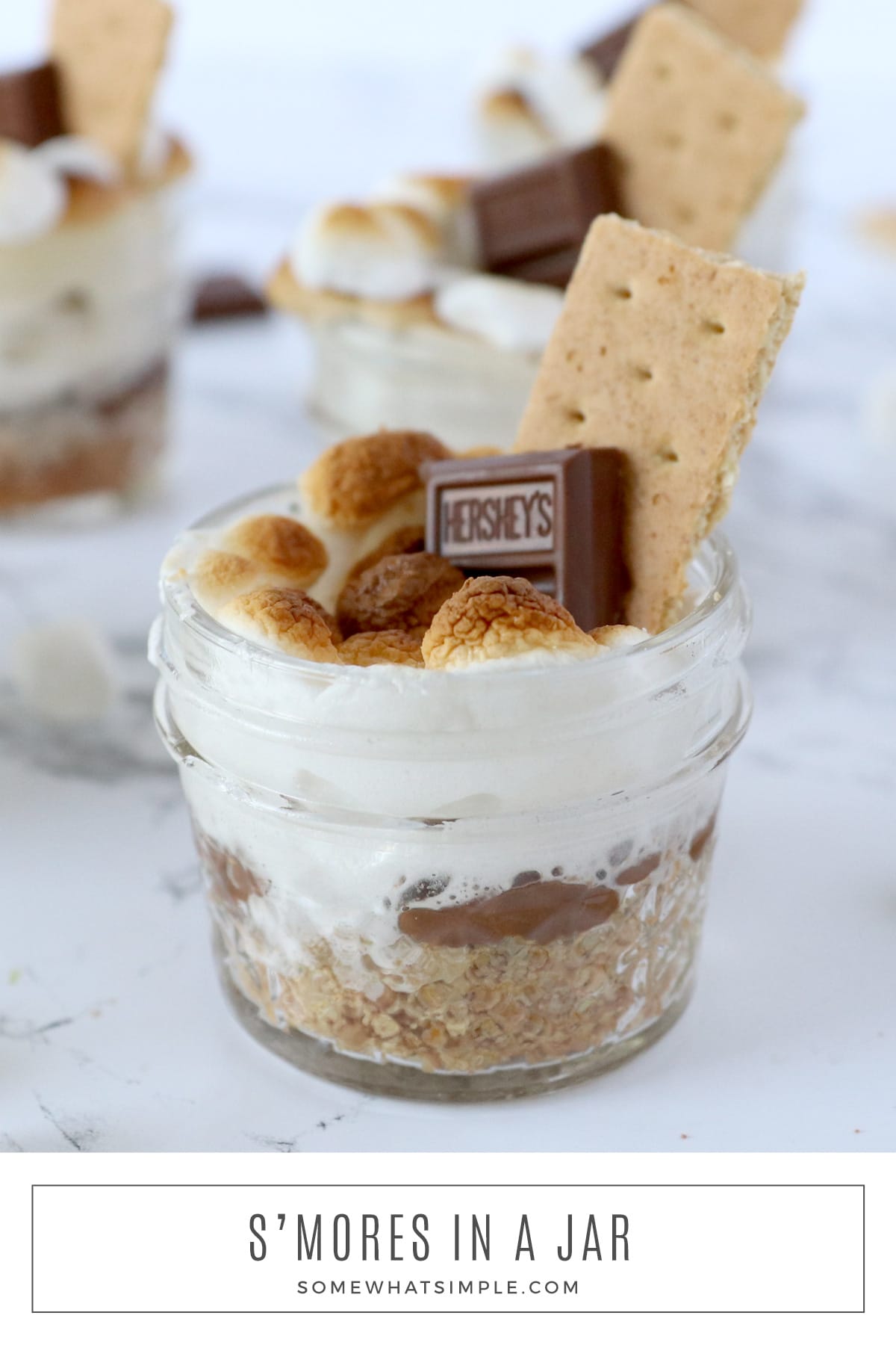 All the flavors from a classic s'more, but simple to put together and practically mess-free! These s'mores in a jar are a perfect summer treat! via @somewhatsimple