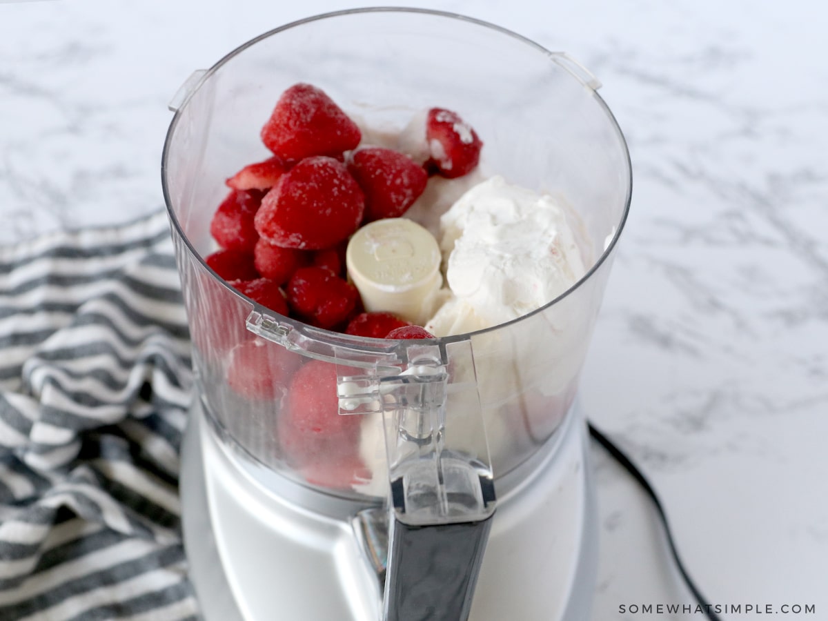 adding ingredients to a food processor