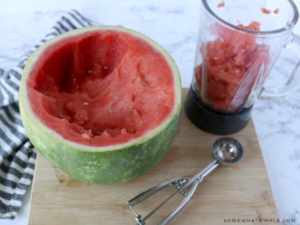 scooping out the flesh in a watermelon
