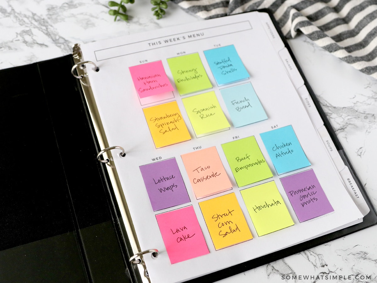 meal plan notebook with colorful post it notes