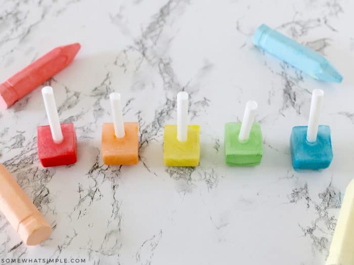 5 rainbow colored sidewalk chalk made from ice cubes