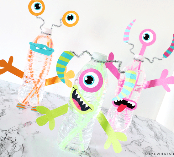 Glowing water bottles made to look like monsters