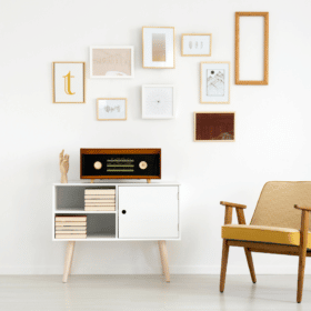 modern living room with collage on the wall above a vintage record player