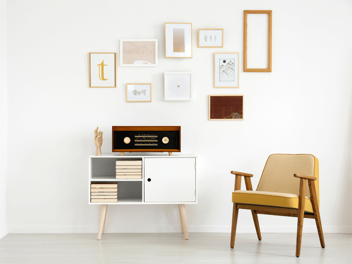 modern living room with collage on the wall above a vintage record player