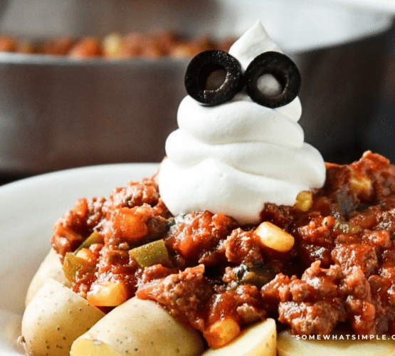 plate of halloween goulash with a ghost made from sour cream on top