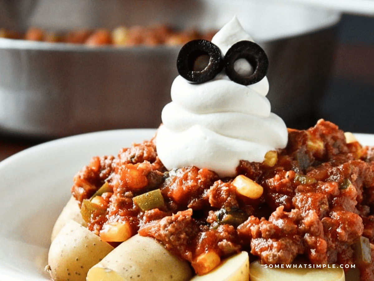 plate of halloween goulash with a ghost made from sour cream on top