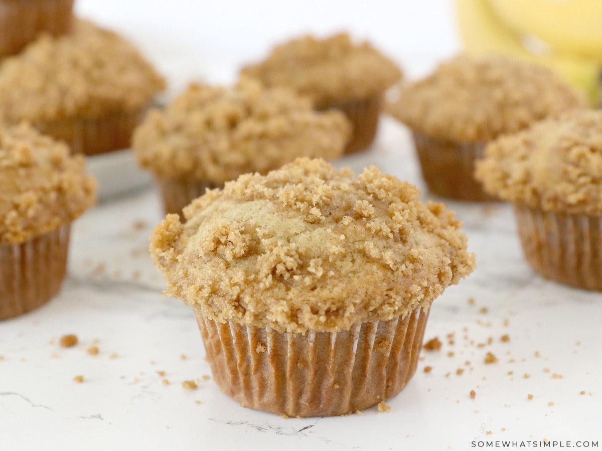 close up of one banana muffin with more in the backgound