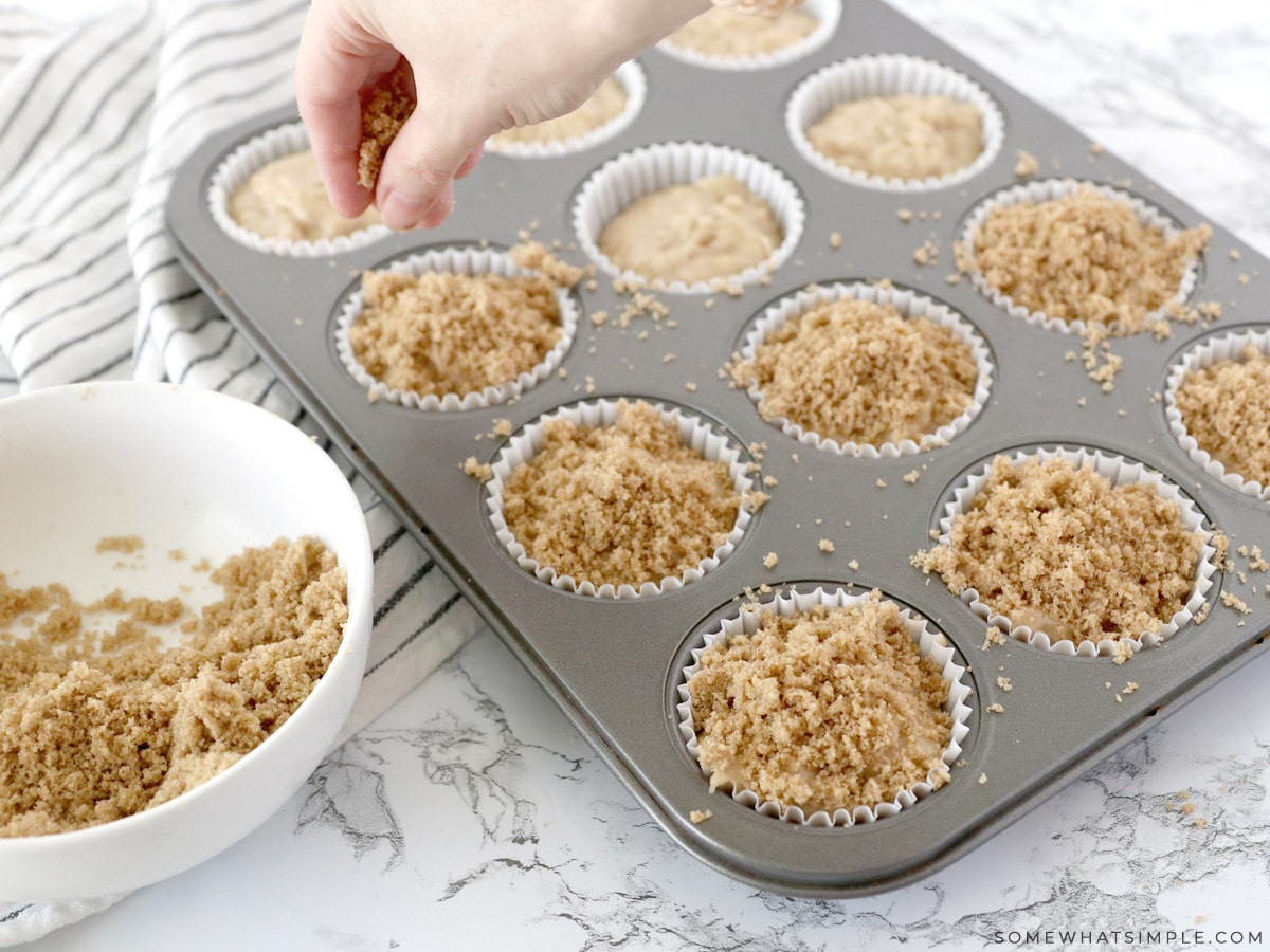 adding crumb topping to banana muffins