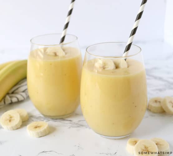 2 glasses filled with a banana smoothie