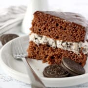 a slice of chocolate cake with oreo frosting