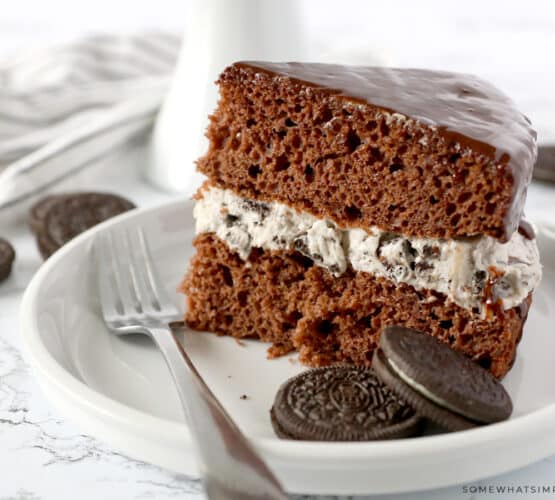 a slice of chocolate cake with oreo frosting