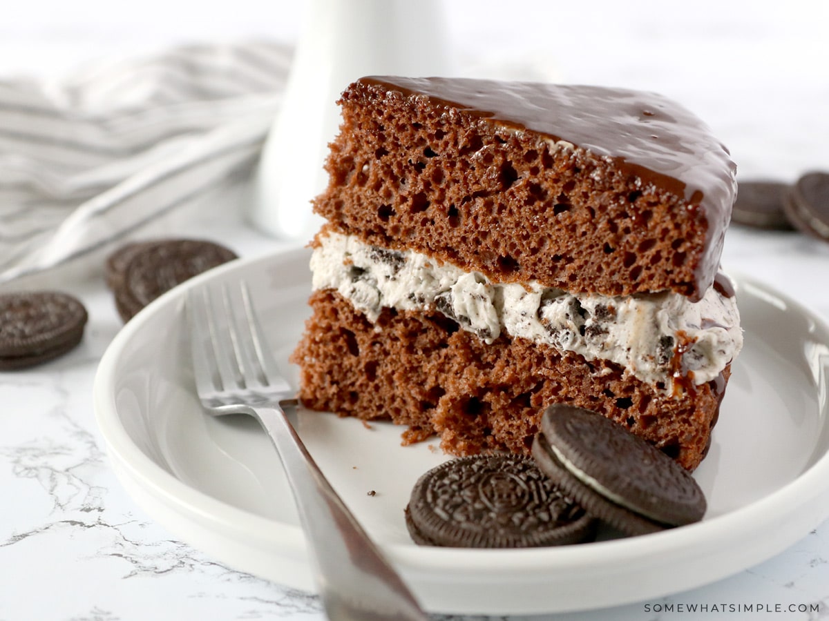 a slice of chocolate cake with oreo frosting