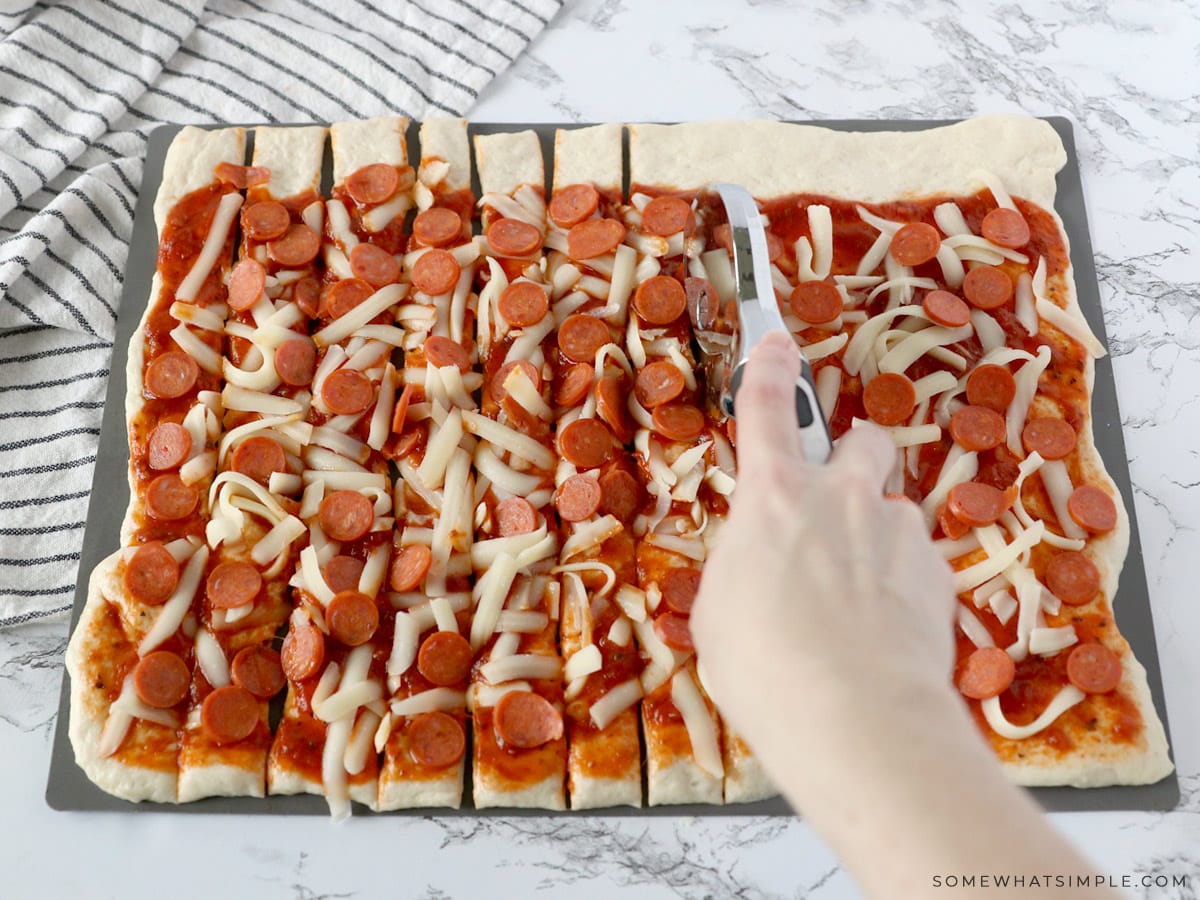 cutting dough into strips