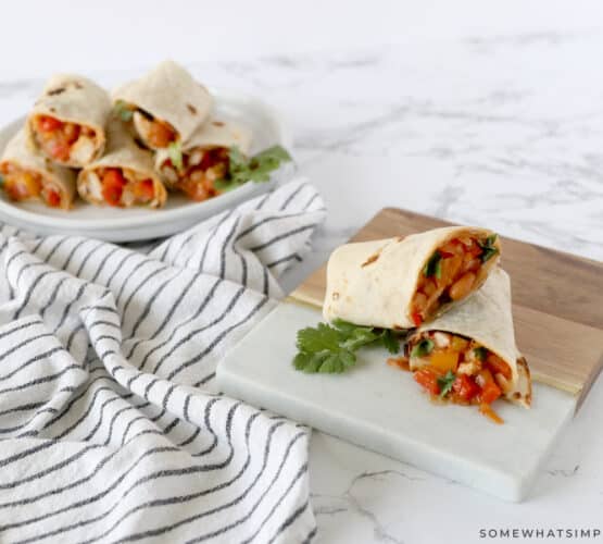 bbq chicken rolled up in a tortilla ready to be eaten