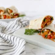 rolled up tortillas filled with chicken and veggies