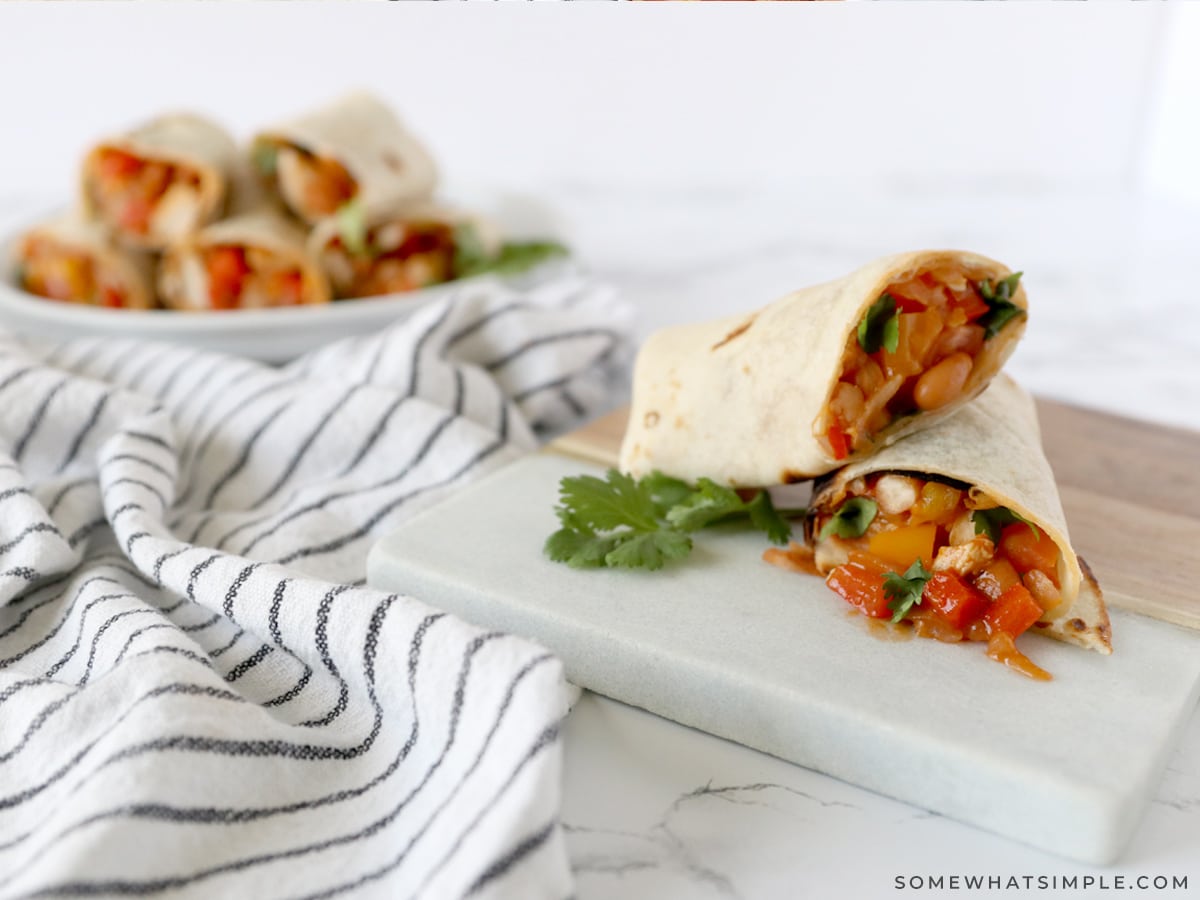 rolled up tortillas filled with chicken and veggies