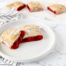 baked cherry strudel on a white plate