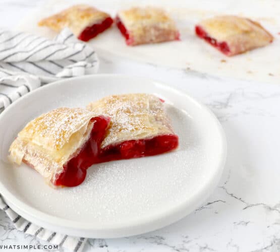 baked cherry strudel on a white plate