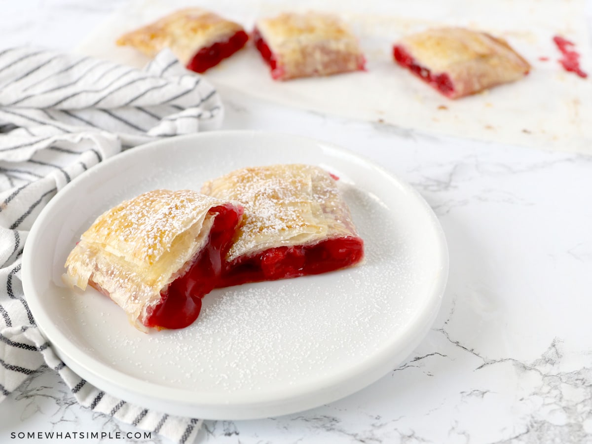 baked cherry strudel on a white plate