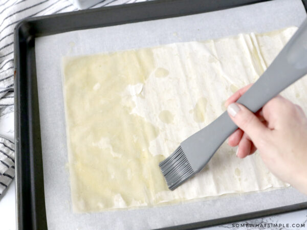 brushing filo dough with melted butter