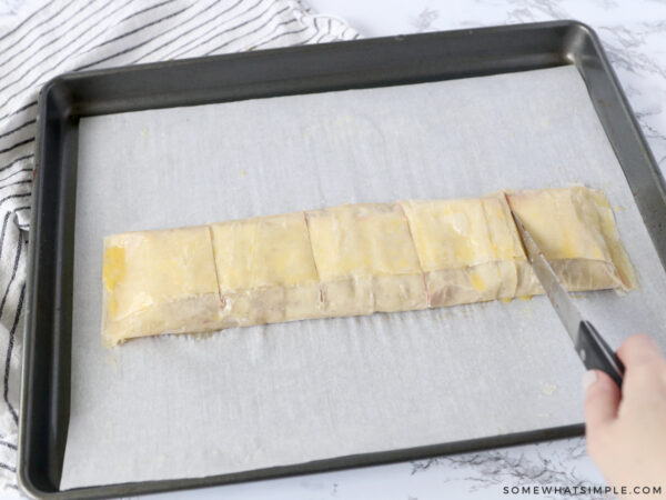 cutting slits into a cherry pastry to vent during baking