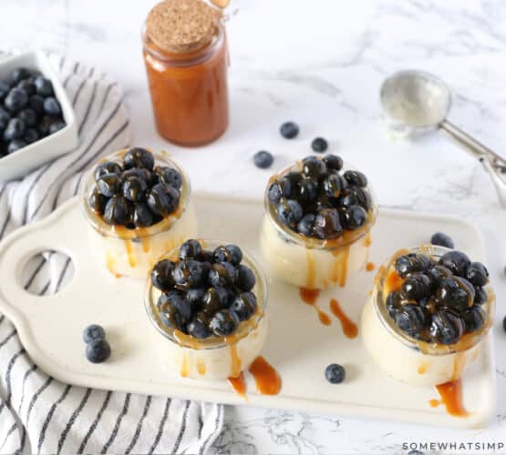 salted caramel pudding parfaits in small glass dishes on a serving tray