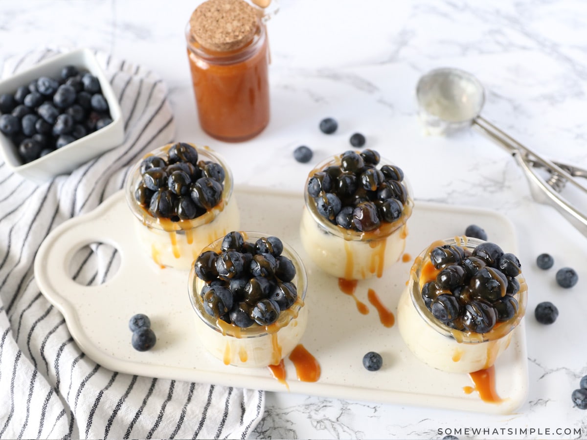 salted caramel pudding parfaits in small glass dishes on a serving tray