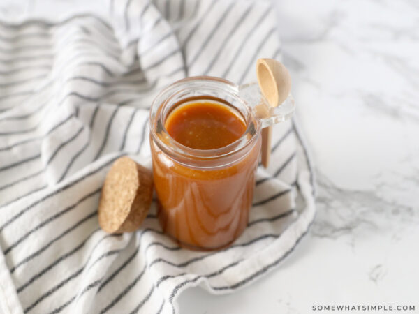 finished caramel sauce in a small jar