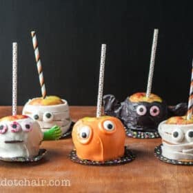 candy apples decorated like monsters for halloween