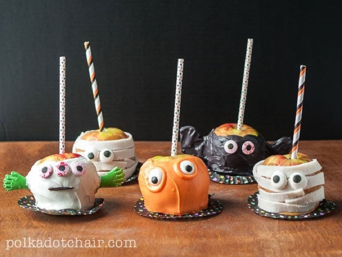 candy apples decorated like monsters for halloween