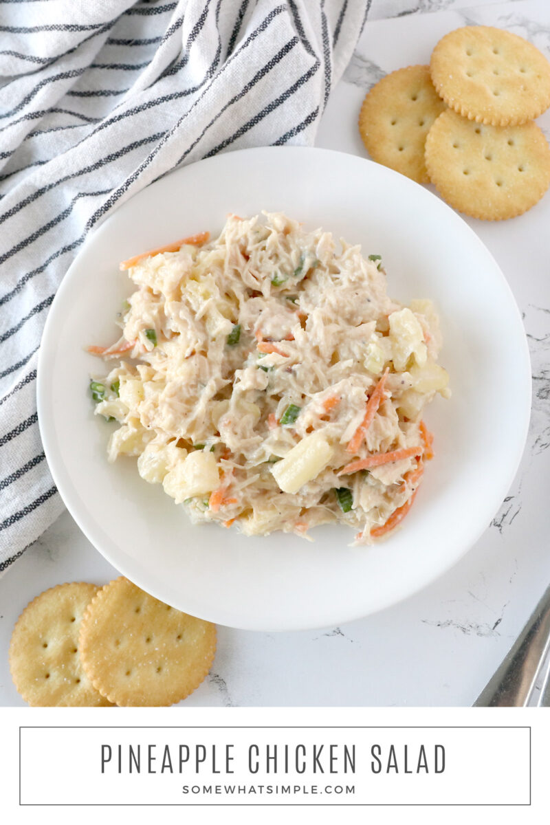 long image of pineapple chicken salad in a white bowl