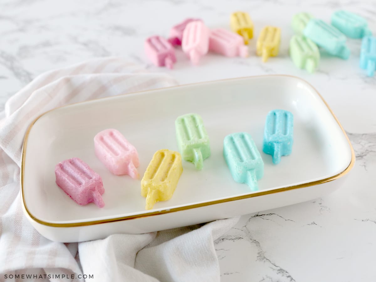 colorful popsicle soap in a glass dish