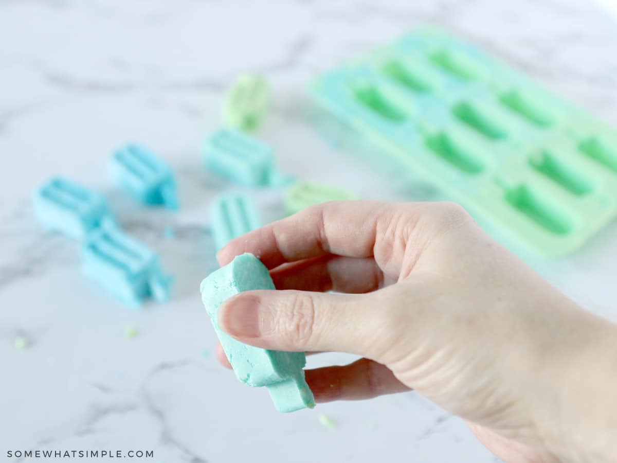 holding a tiny popsicle soap