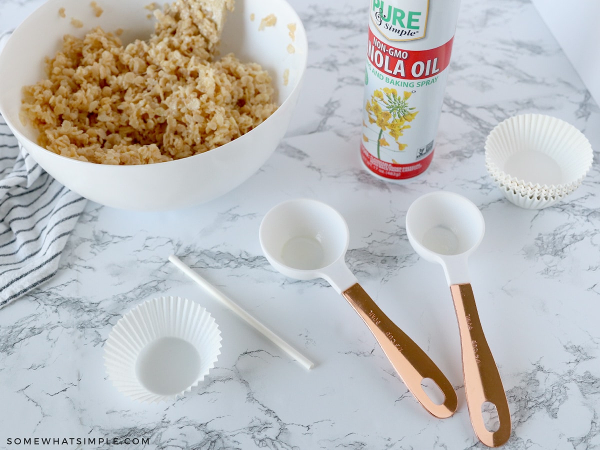 scooping rice krispy treats with measuring cups