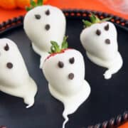 white chocolate coveed strawberries made to look like ghosts