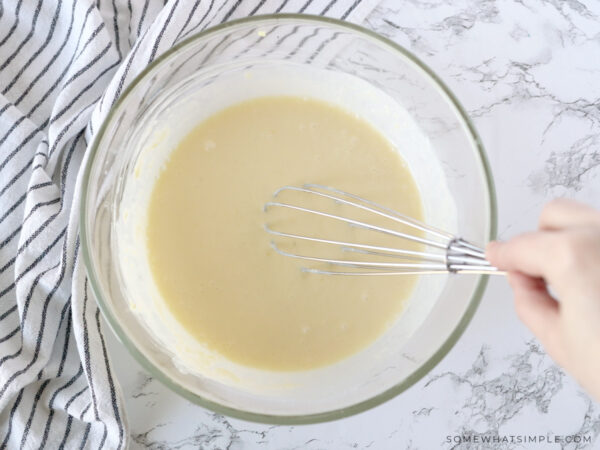 mixing souffle ingredients in a glass bowl