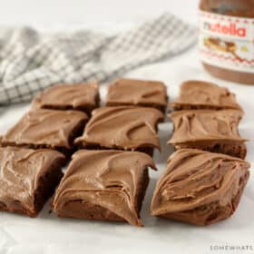 brownies cut into 9 squares and sitting on parchment paper