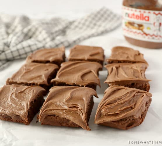 brownies cut into 9 squares and sitting on parchment paper