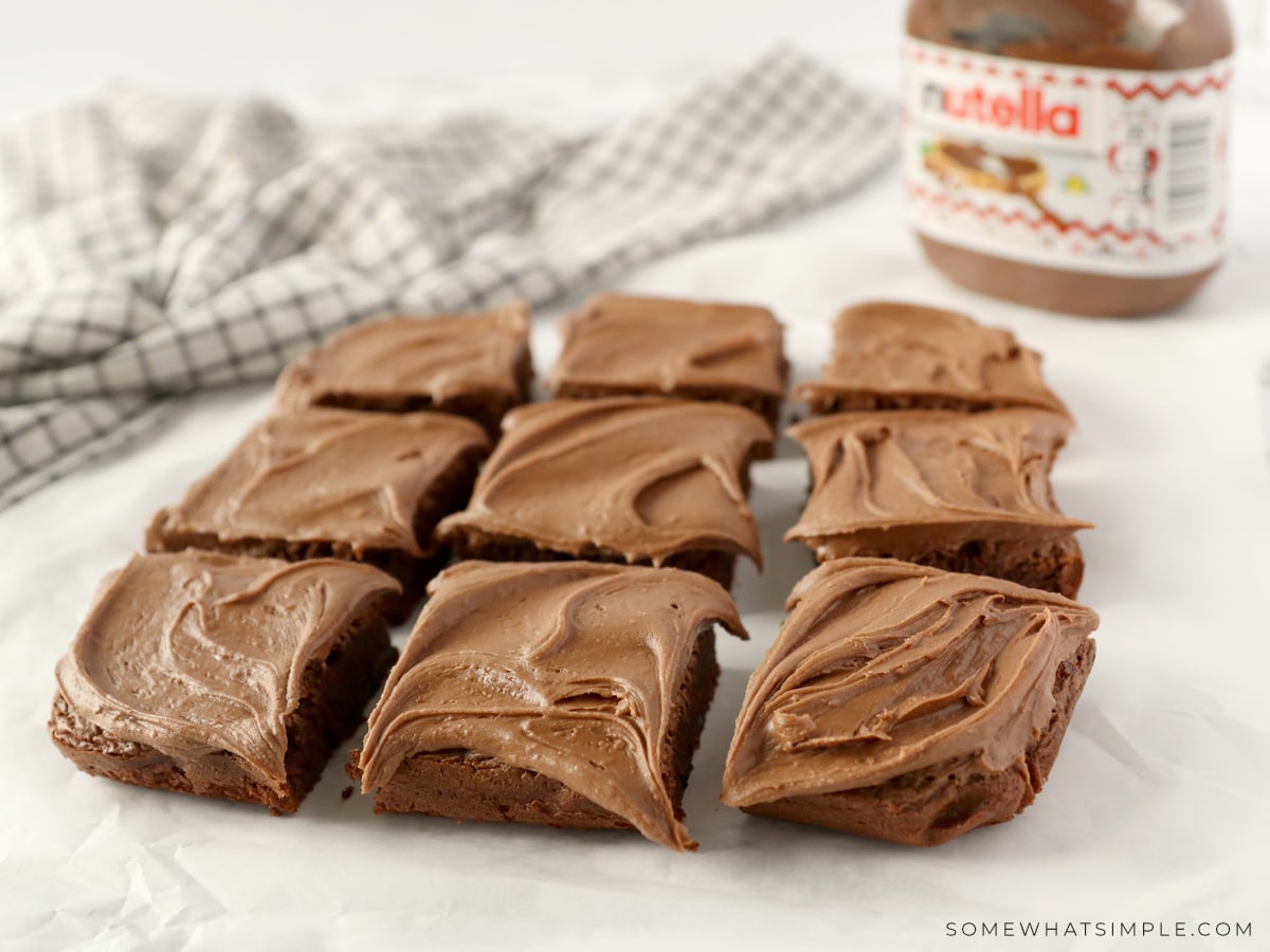 brownies cut into 9 squares and sitting on parchment paper