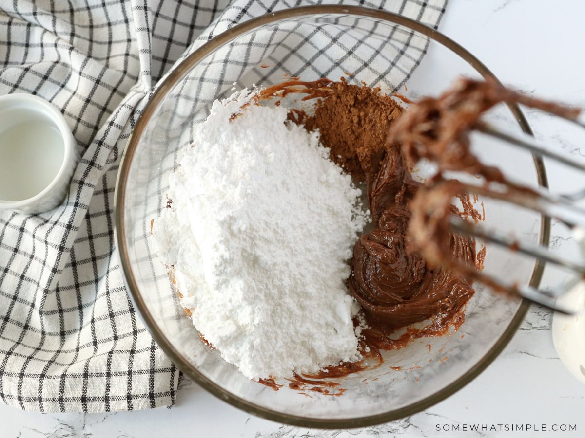 adding powdered sugar to make frosting