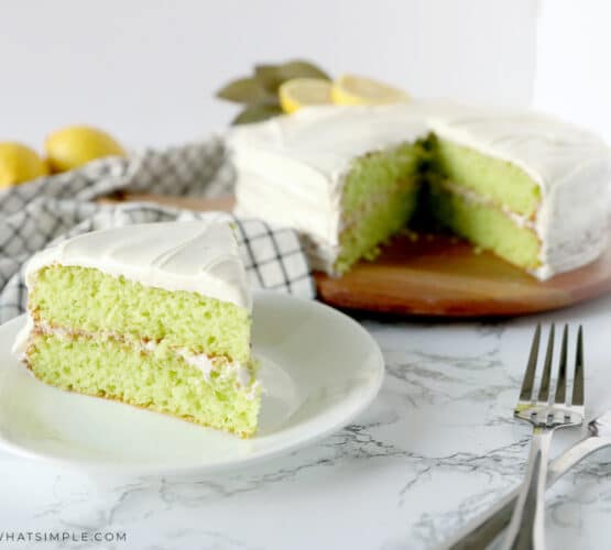 lime cake cut and served on a white plate